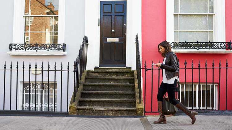 Lady using a renters guide to help select her new apartment.